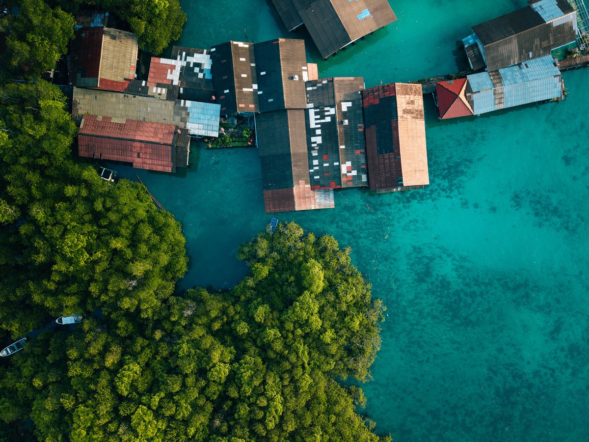 Aerial view of a stilt village over turquoise water, Palau